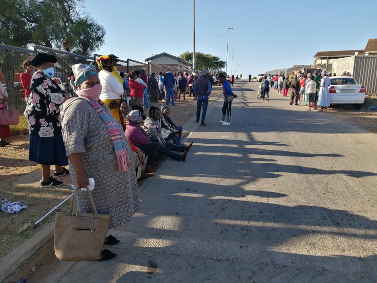 Photo of people outside the clinic
