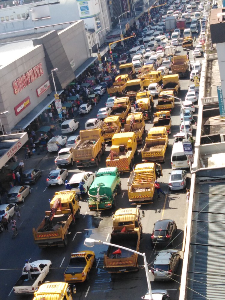 Photo of trucks blocking street