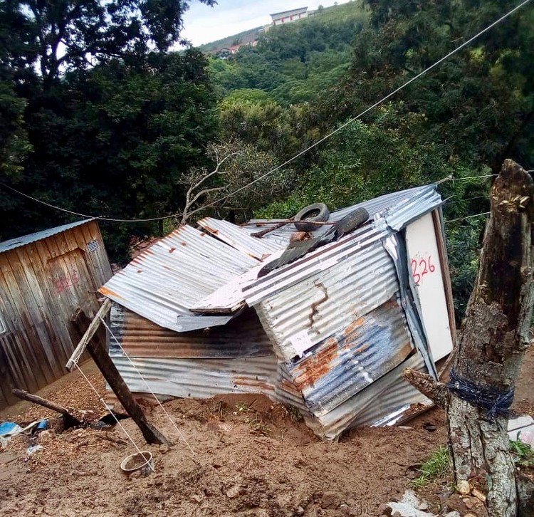 Photo of a shack under mud