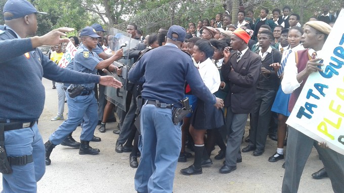 Photo of police confronting protesters
