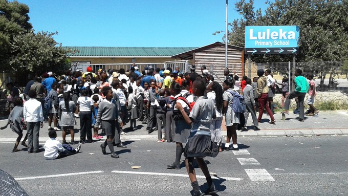 Photo of a crowd outside a school