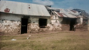 Photo of dilapidated mud school