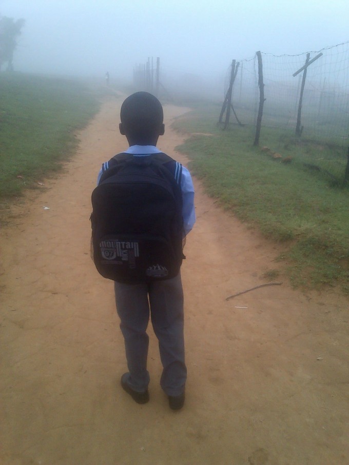 Photo of school child walking into mist 