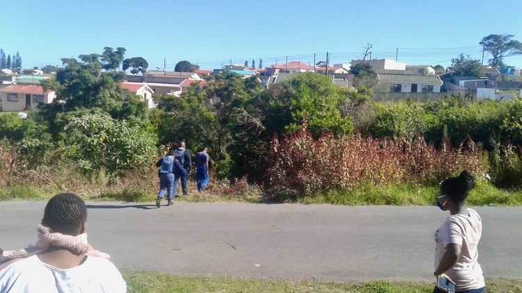 Photo of people going into thick bush