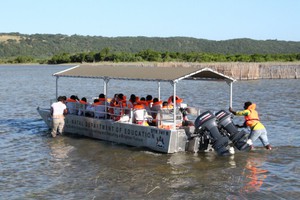 Photo of school children in a boat