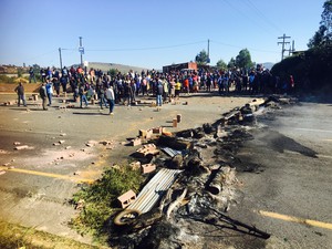 Photo of protesters and blocked road