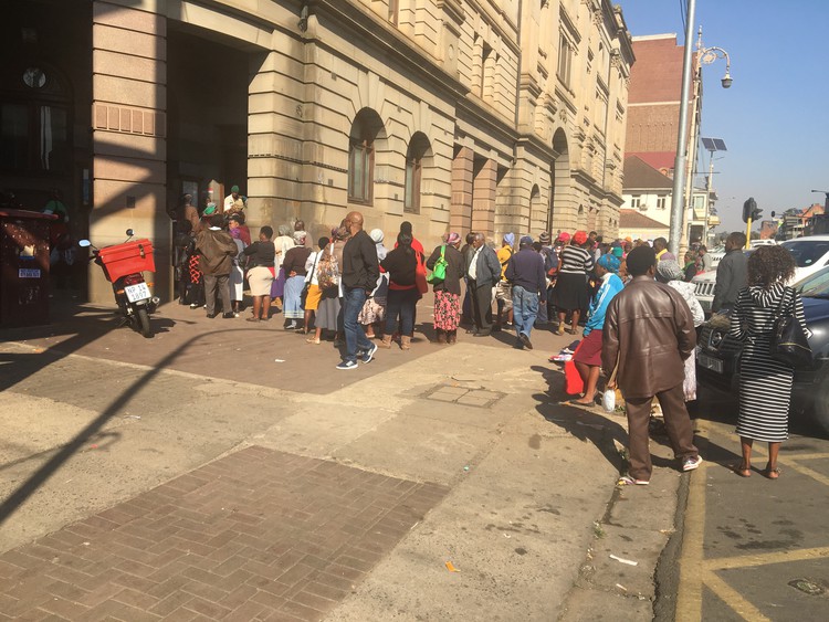 Photo of long queue outside the post office.