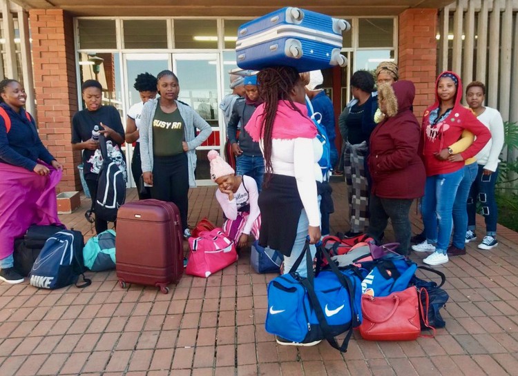 Photo of a group of students with bags