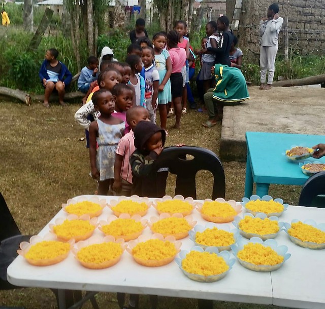 Photo of children queueing for a meal