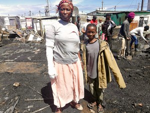 Photo of people in a burnt area