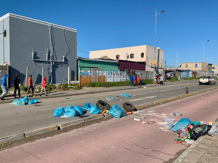 Photo of a rubbish-strewn road