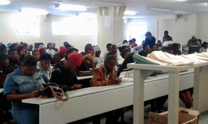 Photo of students at rows of desks