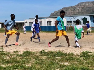 Photo of children playing soccer