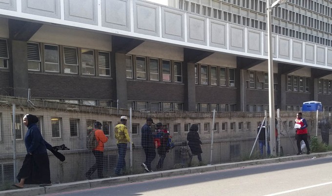 Photo of people queuing in front of Home Affairs offices in Cape Town.
