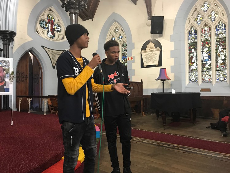 Photo of two boys addressing a meeting