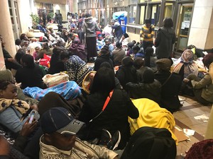 Picture of families camped outside in street