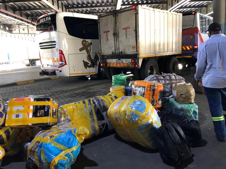 Photo of bags of goods at a bus station
