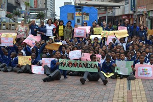 Photo of learners with placards