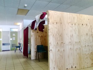 Photo of wooden cubicles inside a hospital ward