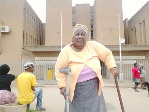 Photo of elderly woman on crutches