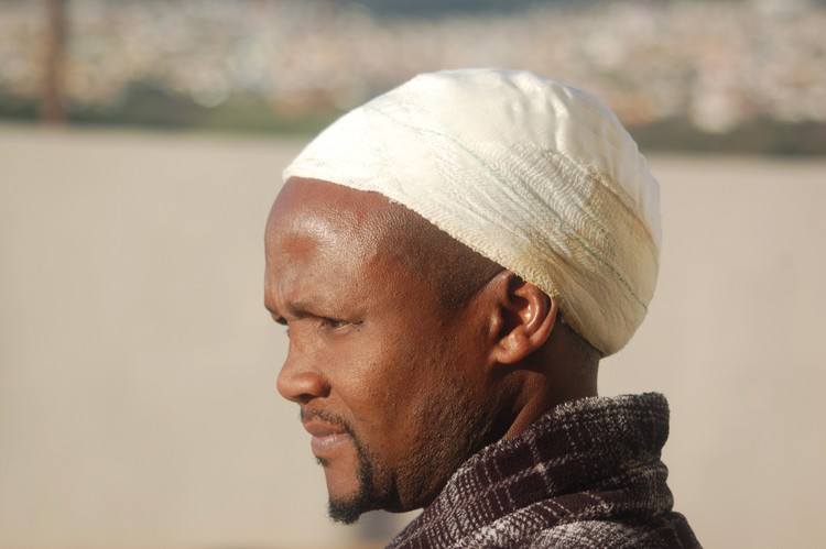 Photo of a man with a bandaged head