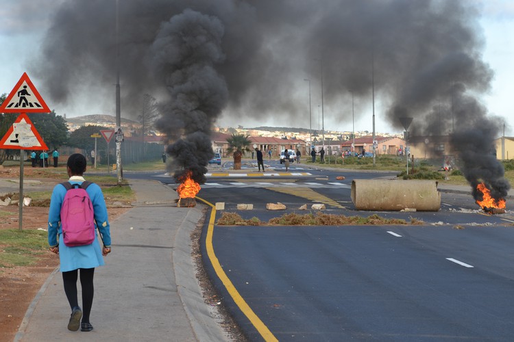 Photo of tyres and rubble blocking a road