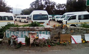 Photo of memorial placards and flowers