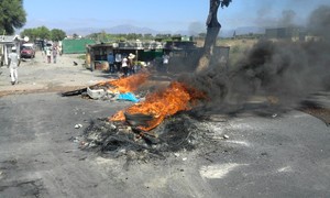 Photo of burning debris across Vanguard Drive