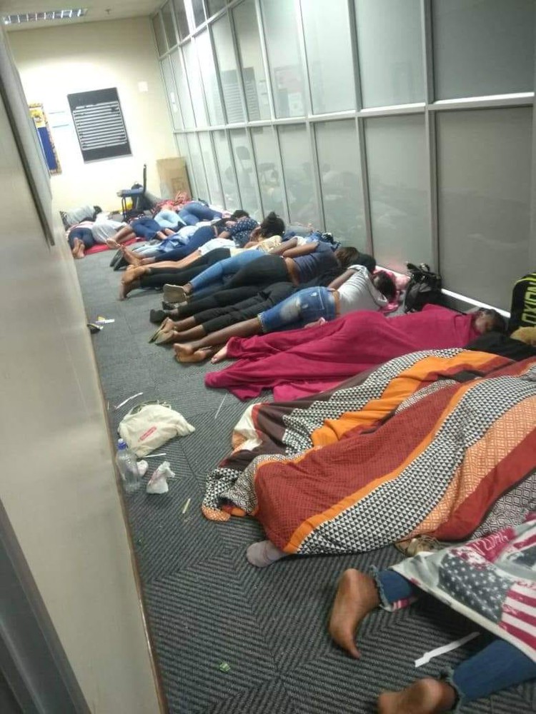 Photo of women sleeping in corridor