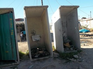 Photo of broken toilets full of rubble