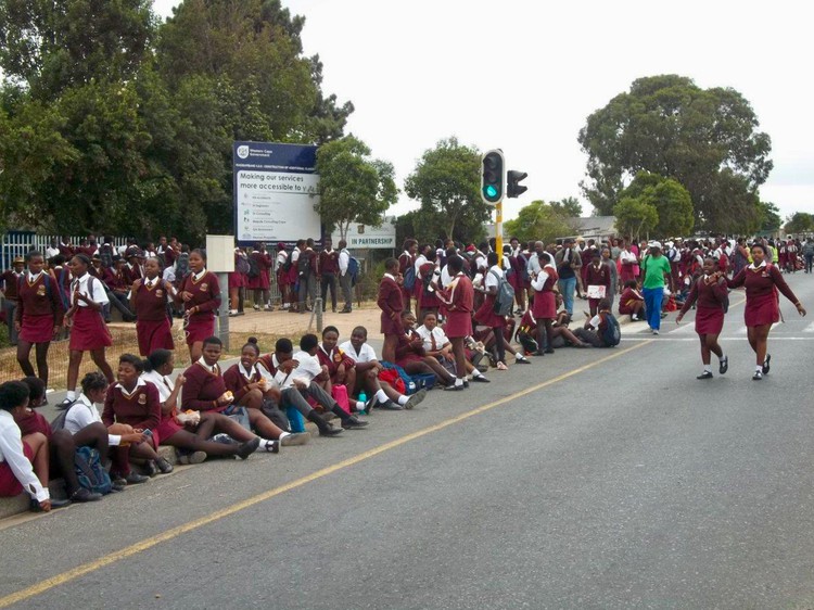 Photo of learners outside a school