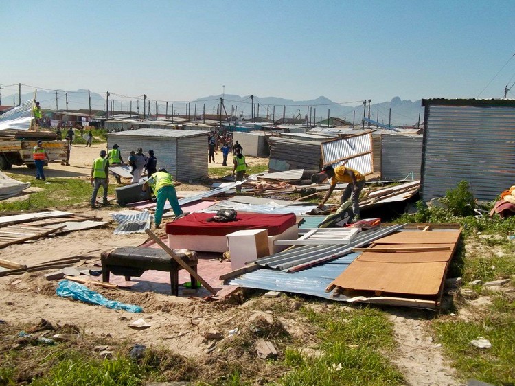 Photo of shacks being dismantled
