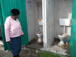 Photo of blocked and overflowing toilets.