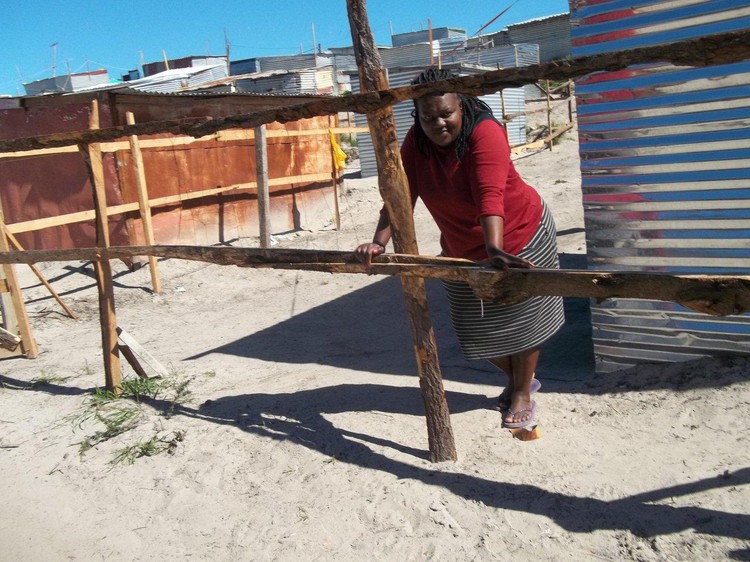 Photo of woman leaning on fence