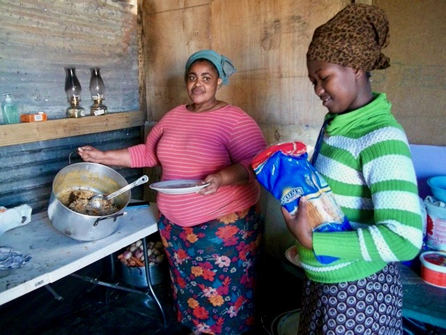 Photo of two women cooking
