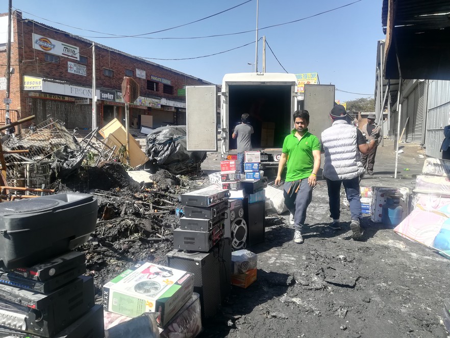 Photo of people salvaging goods