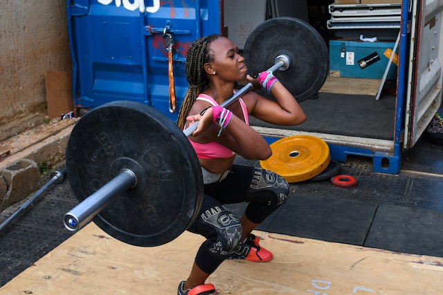 Assistant coach Tiisetso Hlabathe (21) started weightlifting when she was 11. “Weightlifting taught me a lot of things. Through it I managed to finish school, [because] I was disciplined,” she says.