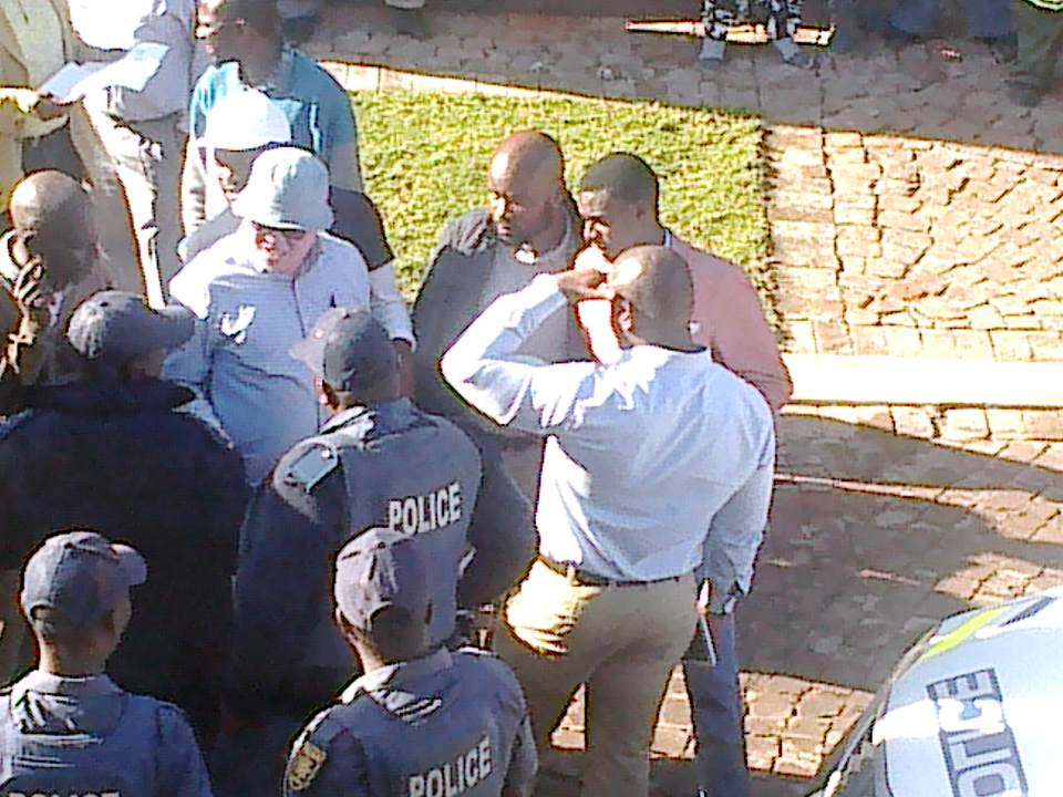 Photo of police and people talking