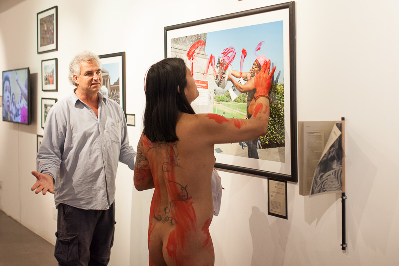 Photo of art being vandalised by a naked person