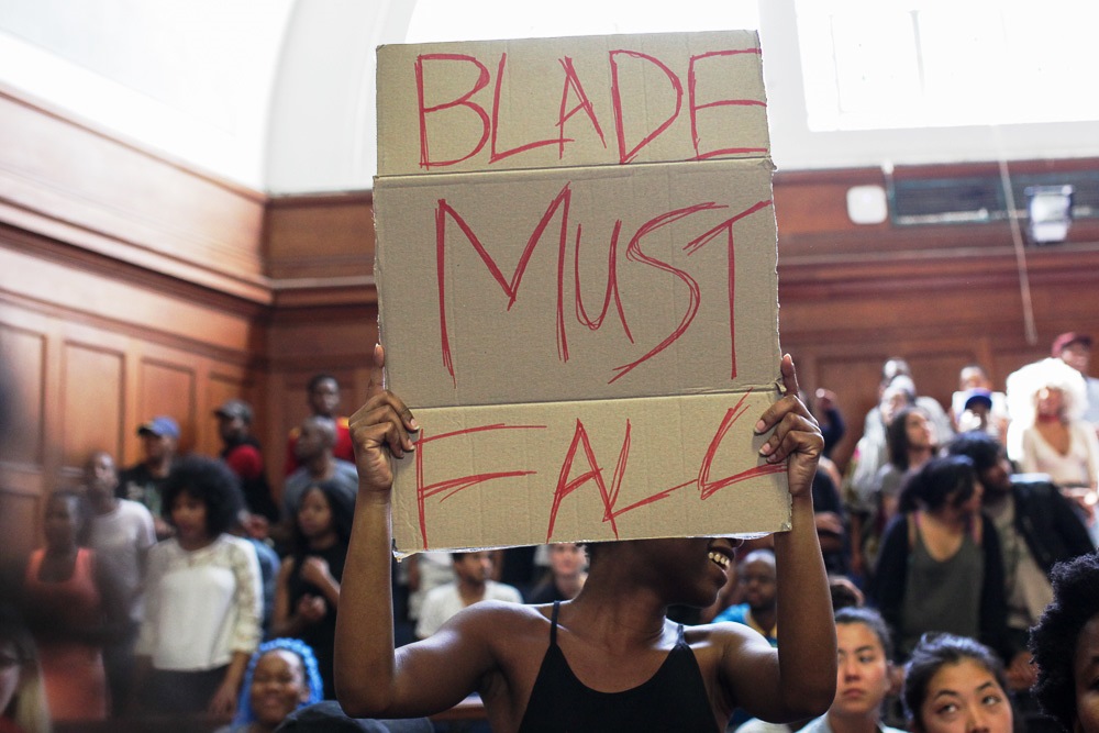 Photo of student holding a placard