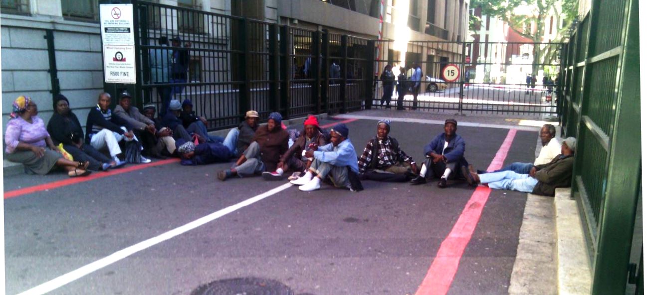 Photo of pensioners sitting in the road
