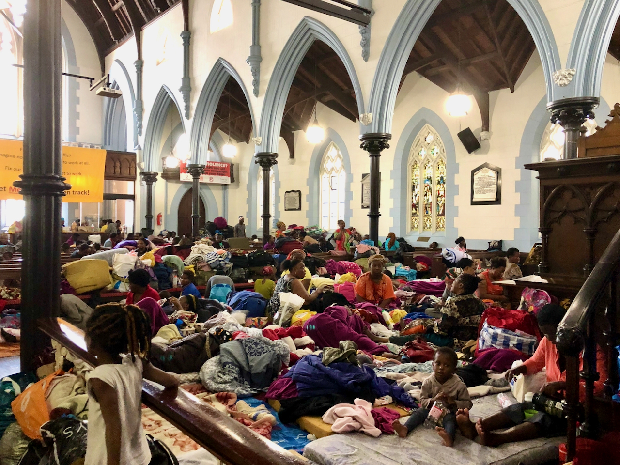 Photo of people living in church