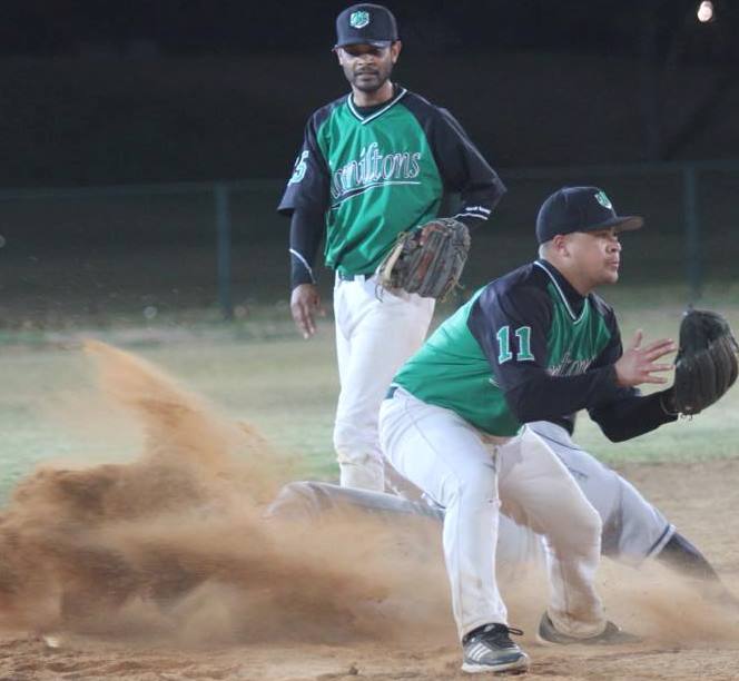 Photo of softball action.
