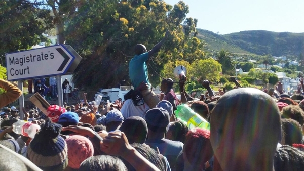 Photo of a man hoisted up by the crowd