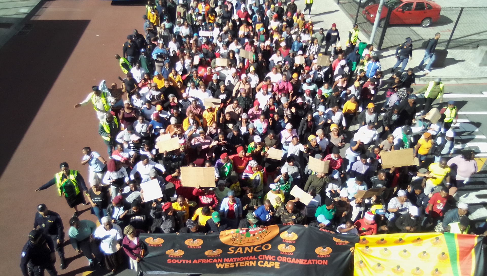 Hundreds march in Cape Town demanding better housing GroundUp
