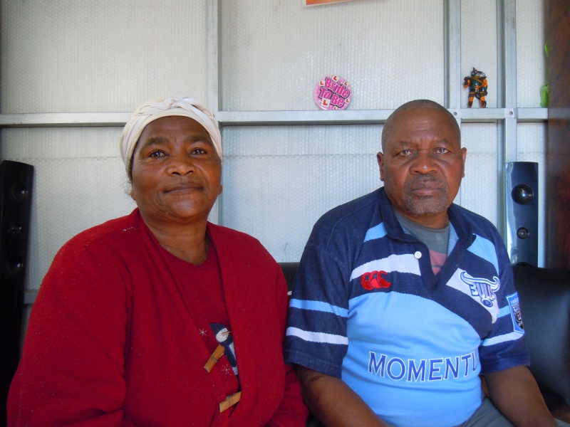 Bettie Ntshintshi and Edward Tatiya in their child's home, where they stay, in Bosasa.JPG